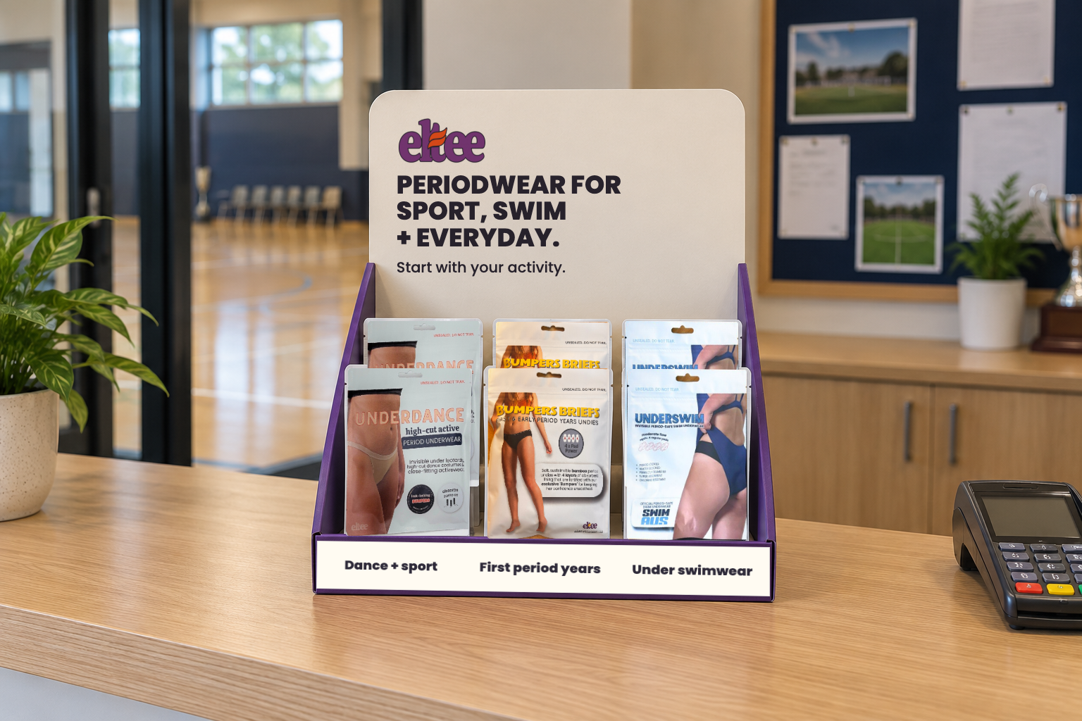 Concept illustration of a mixed-range Eltee countertop display in a simulated club reception; product selection is illustrative